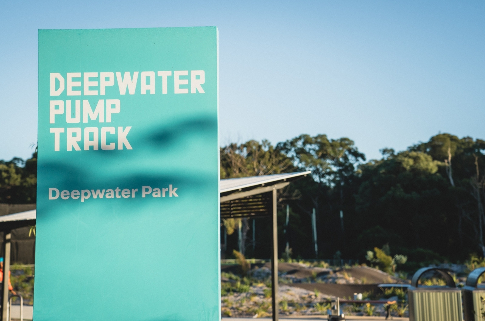 signage of the deepwater pump track on site